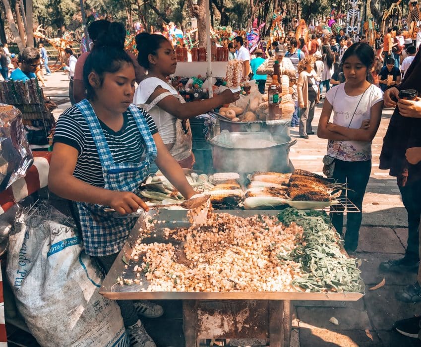 Preparing street food of corn in Mexico City