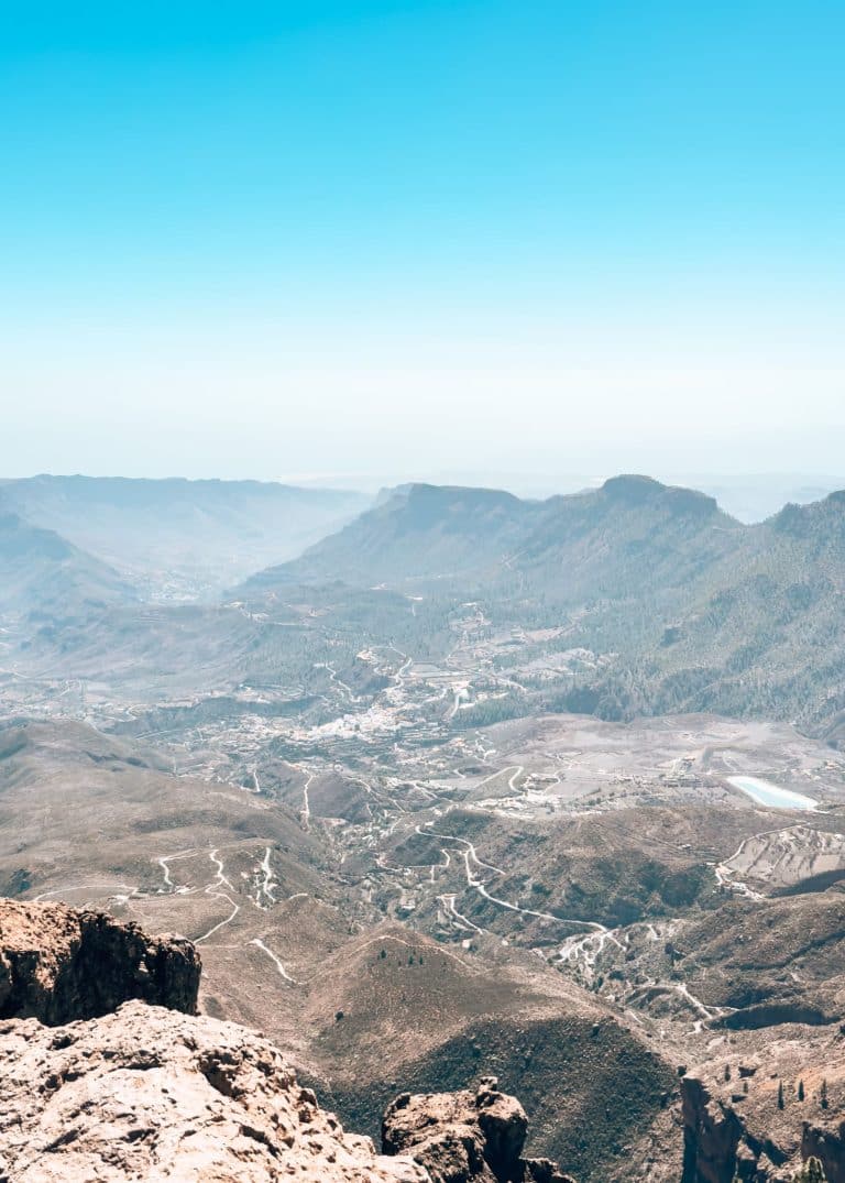 The view from Pico de las Nieves deep into the valley below nestled at the bottom of rugged mountain peaks, Gran Canaria