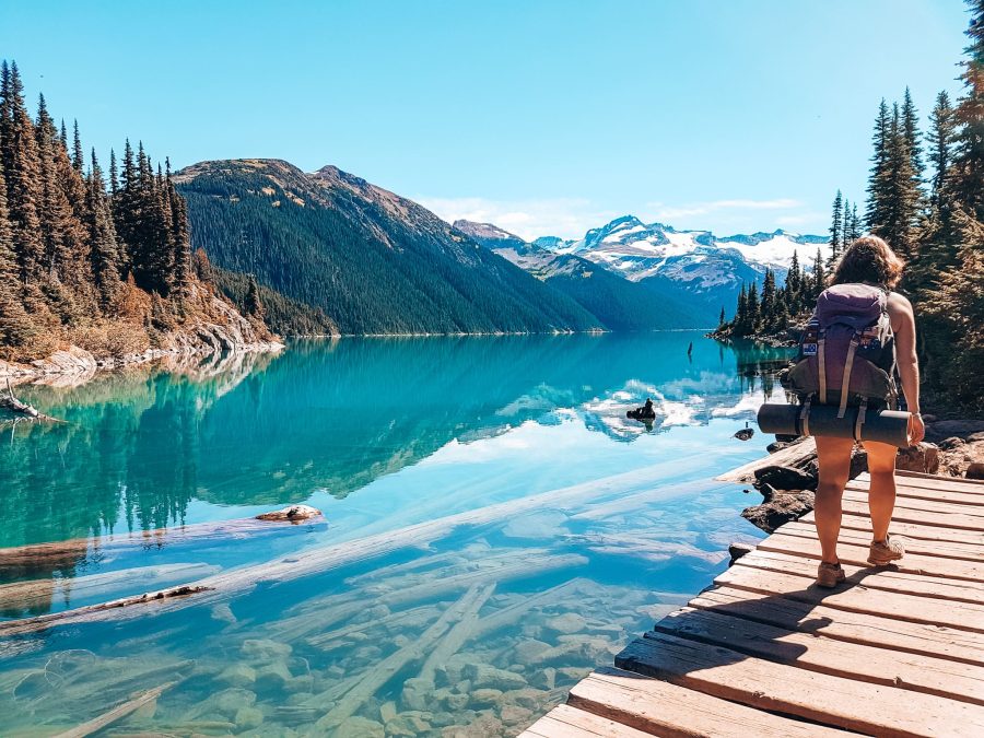 Helen crossing a wooden bridge to Garibaldi Lake Campsite, Garibaldi Provincial Park, Canada