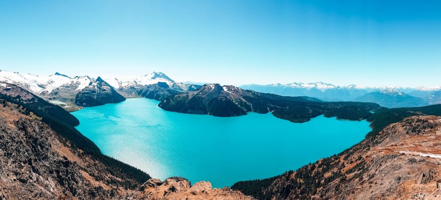 View from Panorama Ridge looking below at the striking turquoise Garibaldi Lake and snow-capped mountains, Garibaldi Provincial Park, Whistler