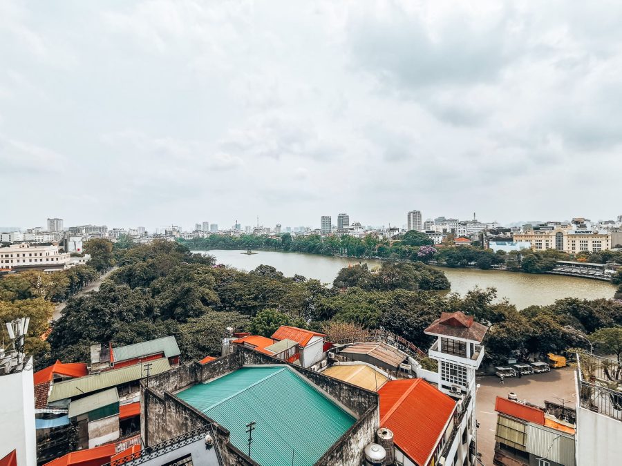 Looking out over colourful houses and the large Hoan Kiem Lake in Hanoi Old Quarter, one of the best places to visit in Vietnam