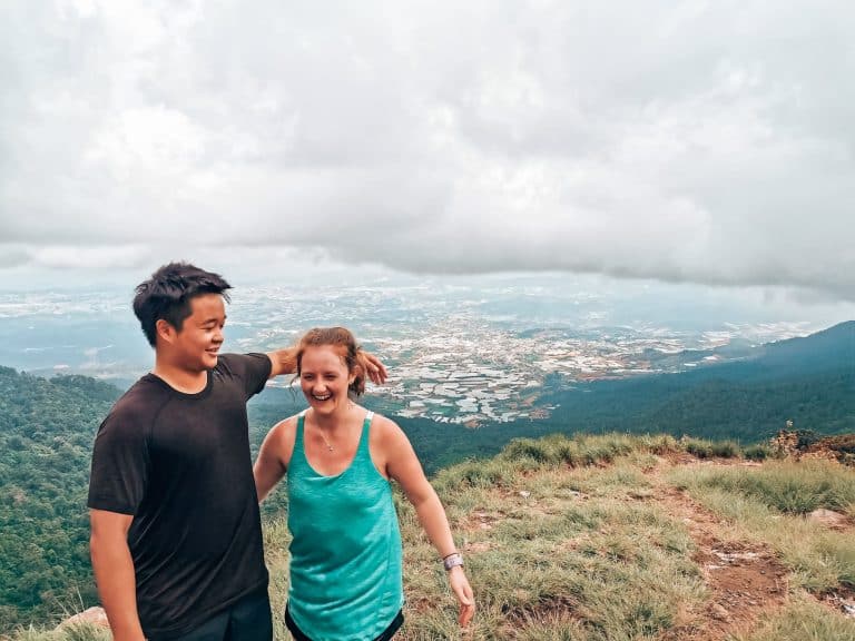 Andy and Helen on the summit of Lang Biang with the town of Dalat far below, Vietnam