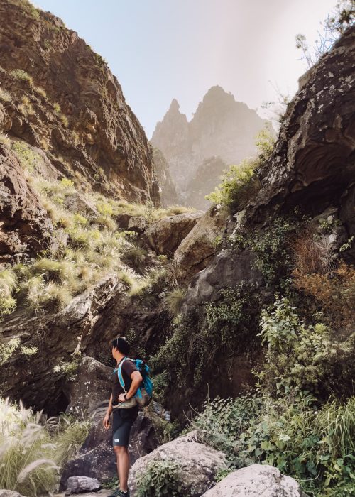 Andy stood in front of dramatic jagged peaks in the Tamadaba National Park, best things to do in Puerto de las Nieves, Gran Canaria