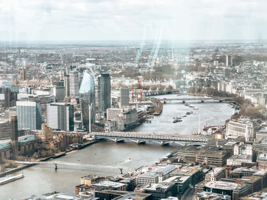 View across West London over Millennium Bridge to the London Eye, Hyde Park, Big Ben and Westminster from Horizon 22 London