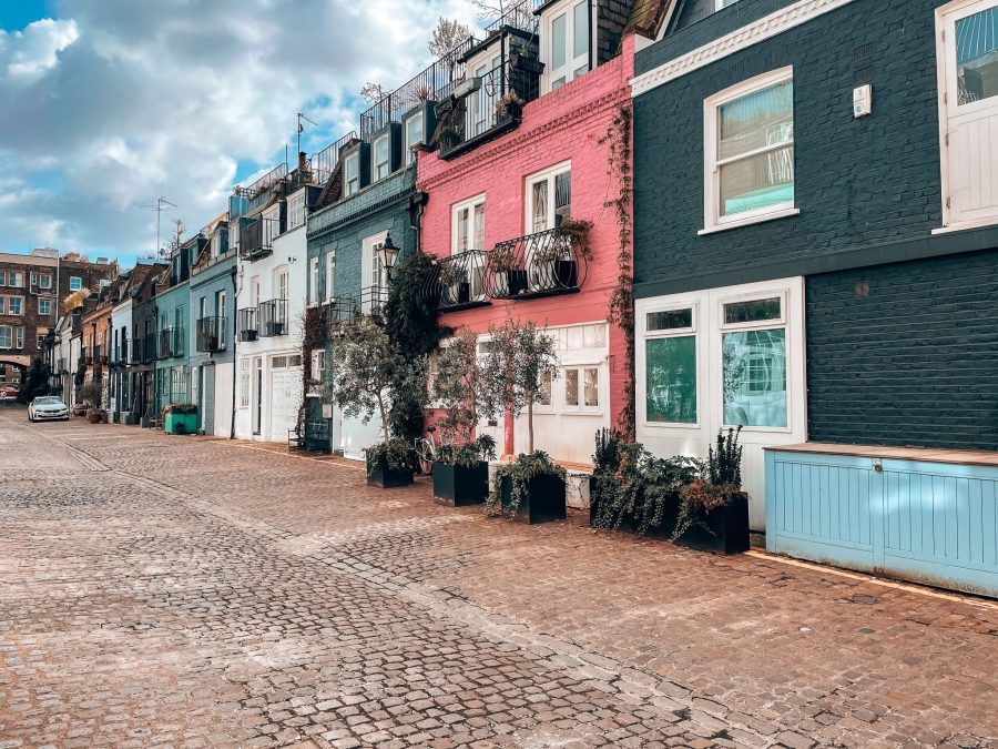 A row of gorgeous and colourful blue and pink terraced houses on Saint Luke's Mews, one of the most famous residential streets in London