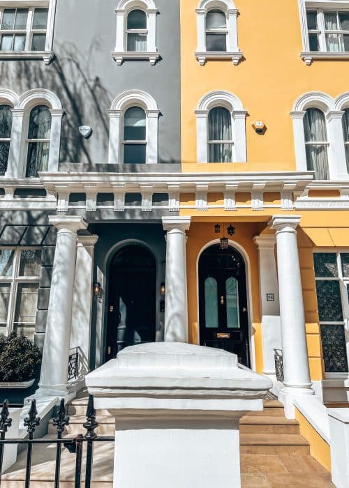 A grey and bright yellow next door to each other, Elgin Crescent, London's prettiest streets