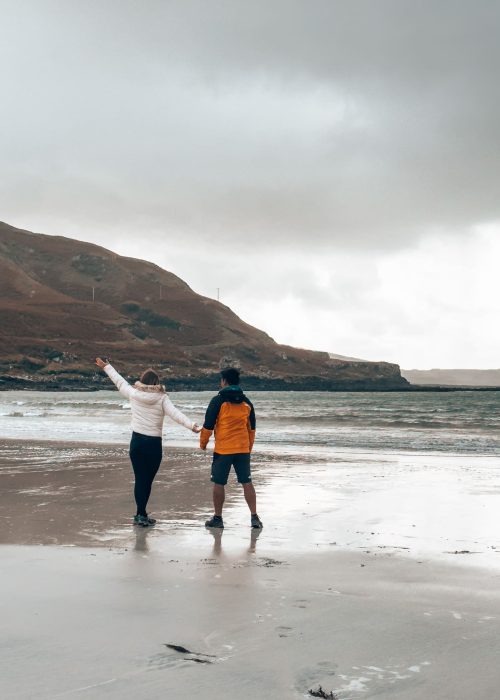 Helen and Andy playing on Calgary Beach, one of the best things to do on the Isle of Mull, Scotland