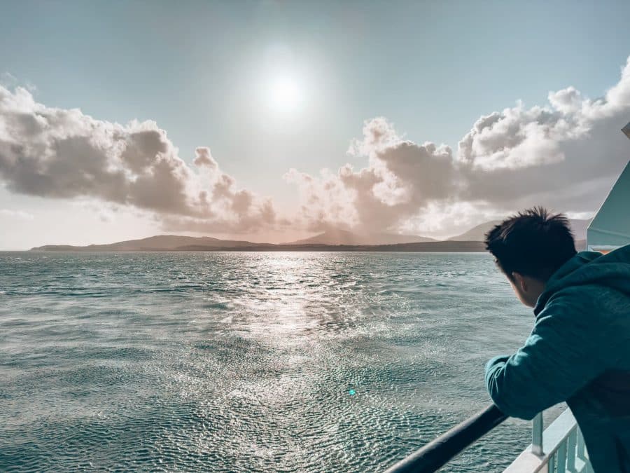 Andy stood leaning over the side of the ferry on the way to the Isle of Mull, Scotland