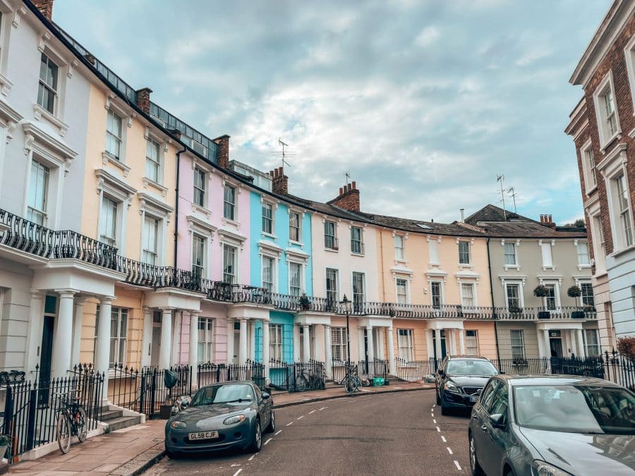 A row of pastel-coloured terraced houses on Chalcot Crescent, Primrose Hill, London