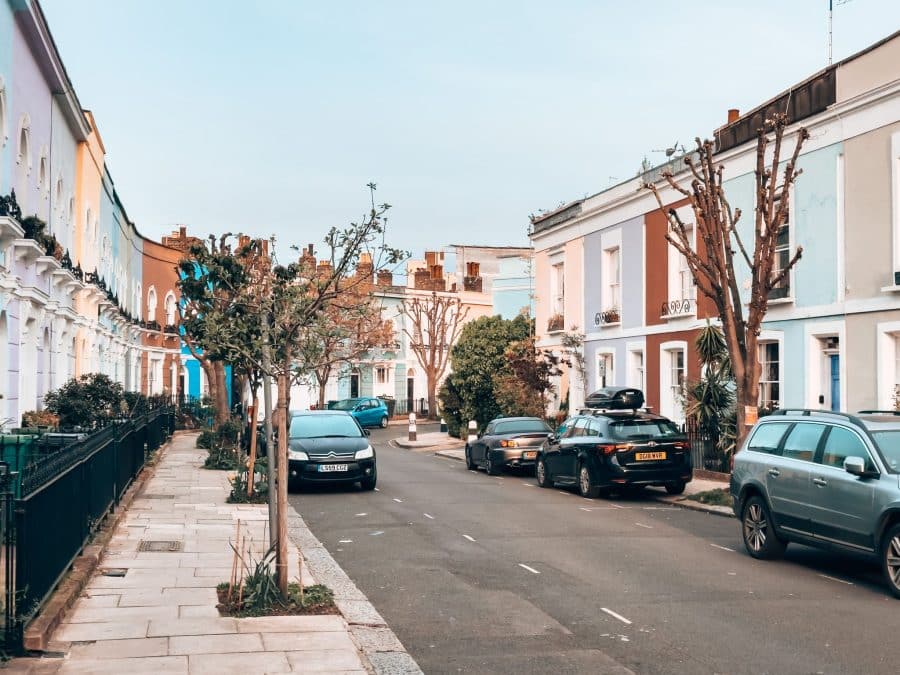 Two rows of bold colourful terraced houses on Kelly Street, one of the most beautiful streets in London