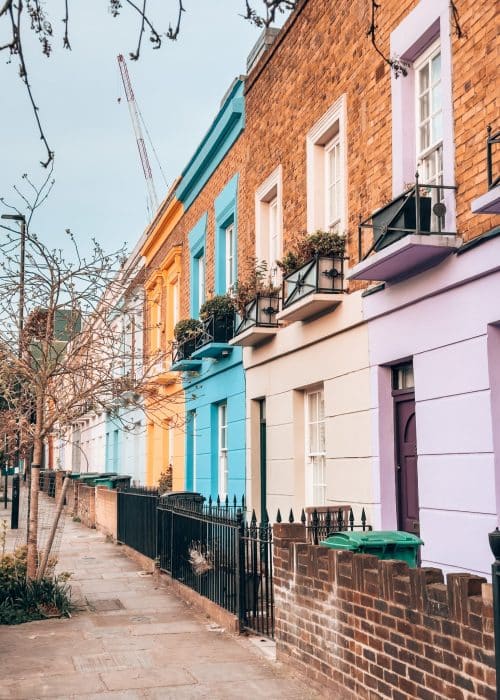 A row of colourful houses on Hartland Road in Chalk Farm, London