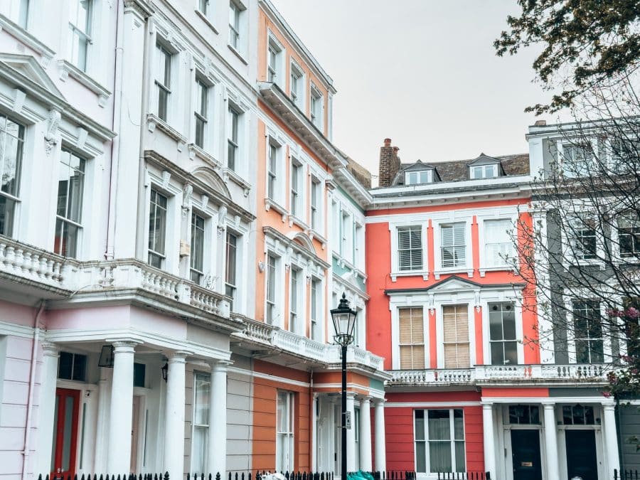 Pastel coloured terraced houses in a square, Chalcot Square, Primrose Hill, London