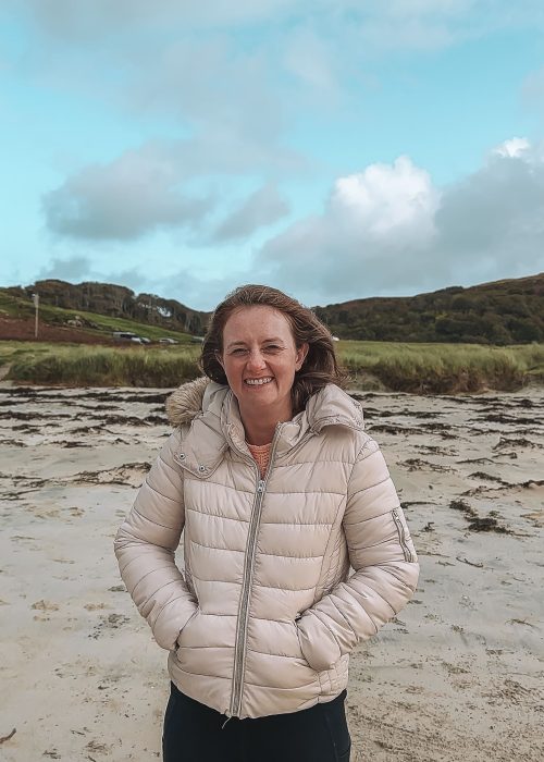 Helen stood on the white sand Calgary Beach, places to visit on the Isle of Mull, Scotland