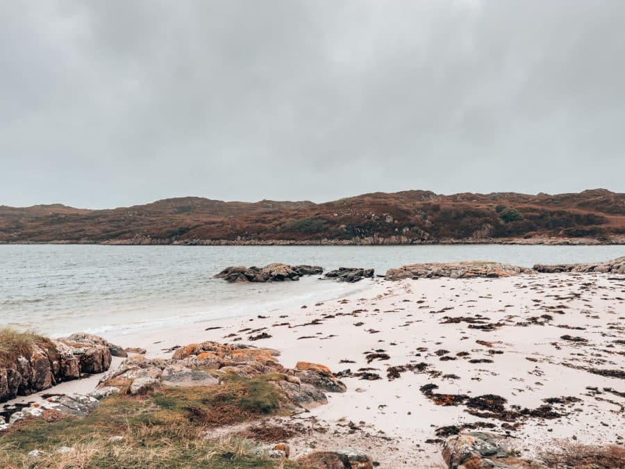 A white sand rugged and rocky beach, Knockvologan, places to visit on the Isle of Mull, Scotland