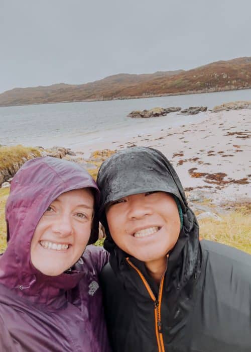 Helen and Andy on Knockvologan Beach in the rain, one of the best things to do on the Isle of Mull