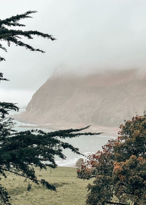 A foggy view of steep cliffs plunging into the ocean at Carsaig, Isle of Mull, Scotland