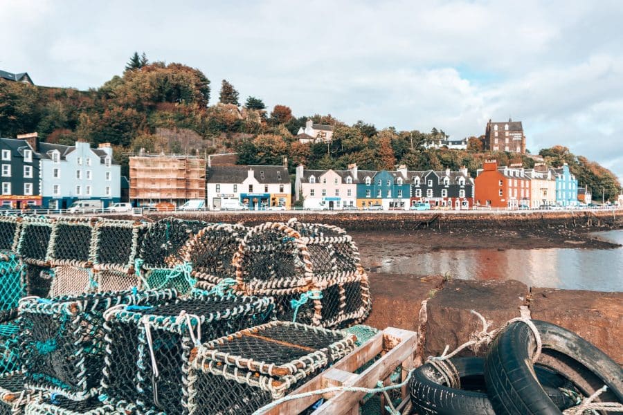 Colourful buildings along the waterfront of Tobermory and fishing nets, Isle of Mull itinerary