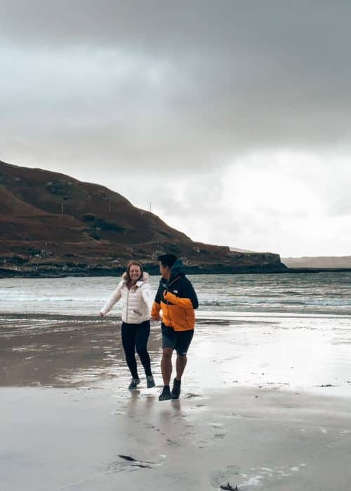 Helen and Andy playing on Calgary Beach, one of the best things to do on the Isle of Mull, Scotland