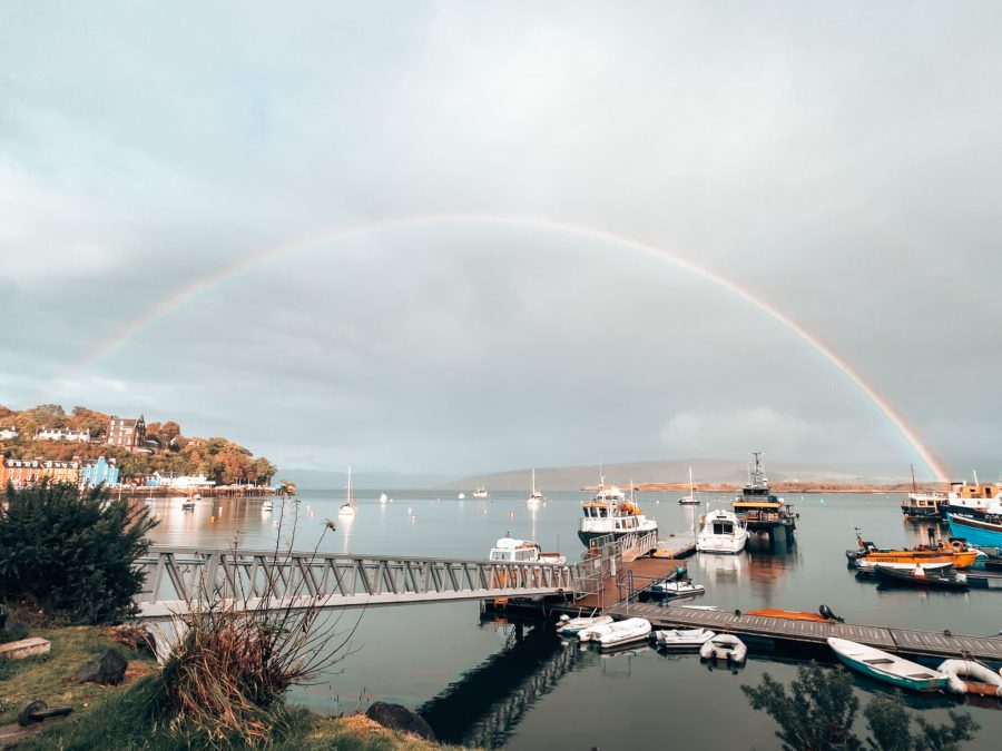 A rainbow over the ocean at Tobermory Harbour with boats in the sea, Isle of Mull itinerary, Scotland