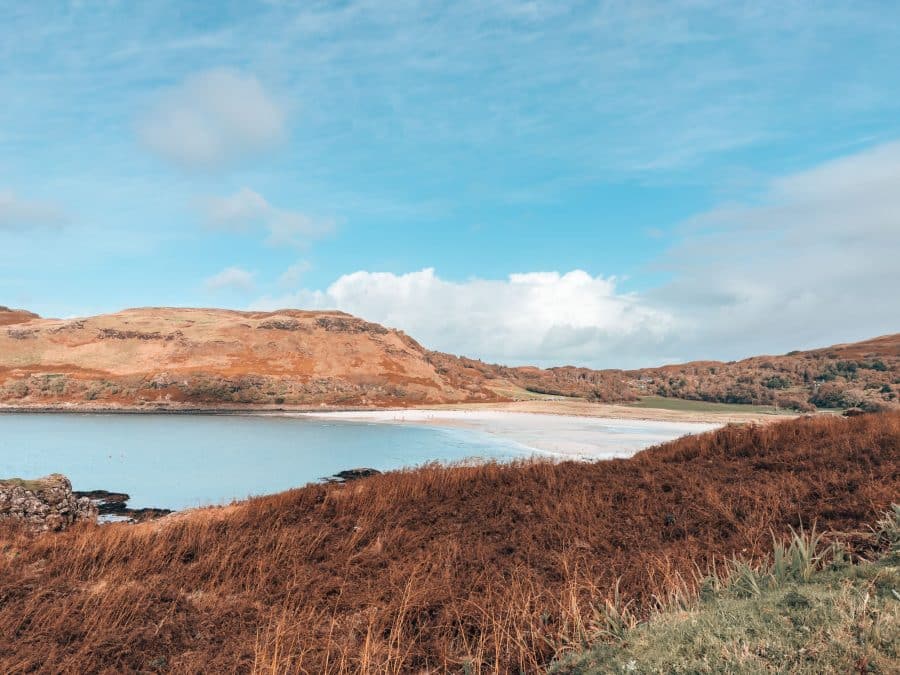 A large expanse of white sand beach and rugged mountains at Calgary Beach, Isle of Mull itinerary