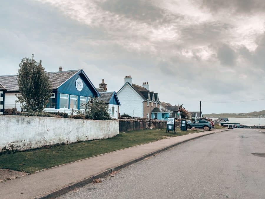 The tiny village of Fionnphort with a few buildings lining the road, Isle of Mull, Scotland