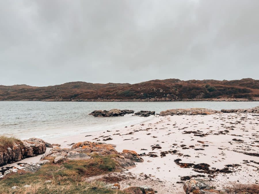 A grey and rainy day and a white sand untouched beach, Knockvologan, places to visit on the Isle of Mull, Scotland