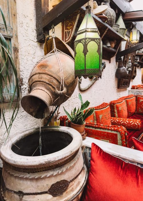 A ceramic pot pouring water in a bowl, Oasis Lounge London, best Moroccan restaurants in London