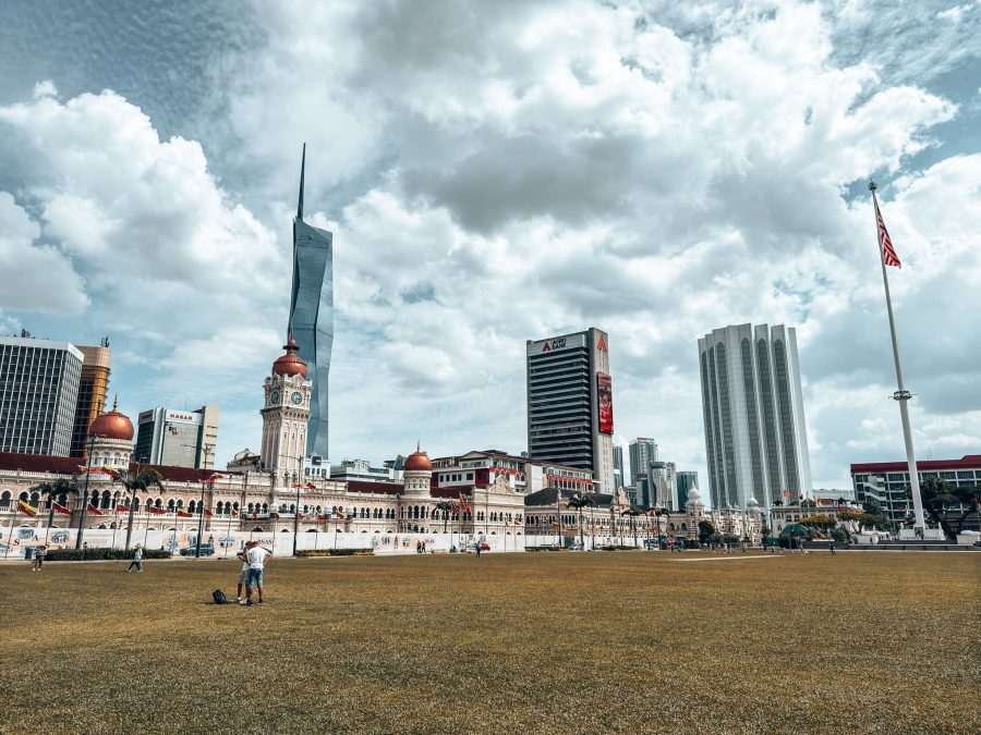 Beautifully landscaped grass with a tall flagpole and colonial buildings, Merdeka Square, Kuala Lumpur, Malaysia