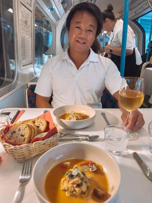 Andy with his glass of wine and ceviche at Walthamstow Supperclub, London