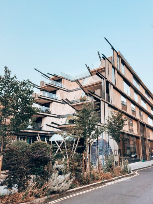 Exterior of the Nobu Hotel London Shoreditch with balconies overlooking greenery