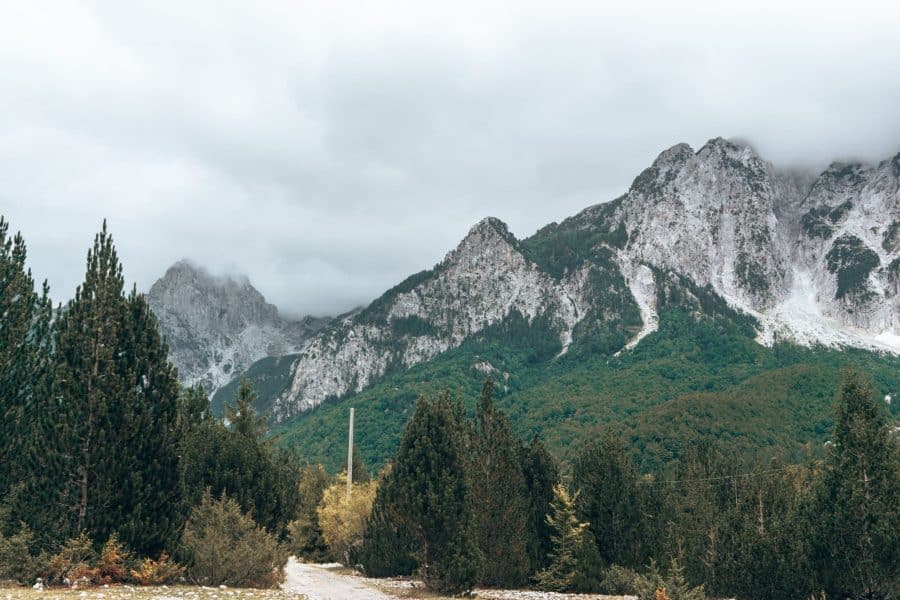 Towering mountain peaks with lush greenery underneath, Valbona to Theth Hike, Albania