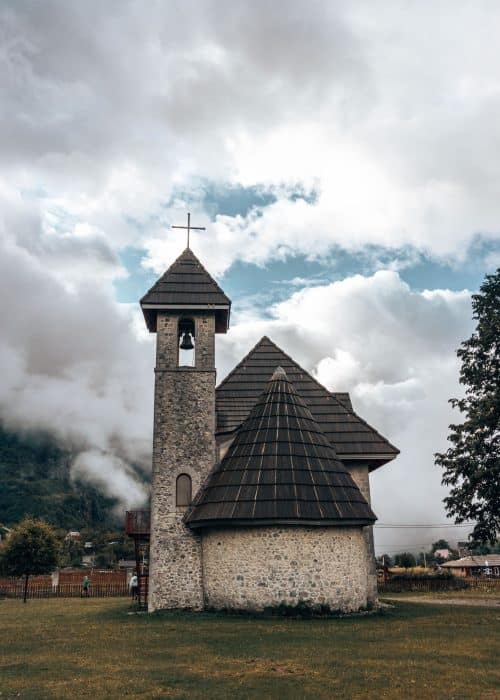 The picturesque Church of Theth surrounded by clouds and mountains