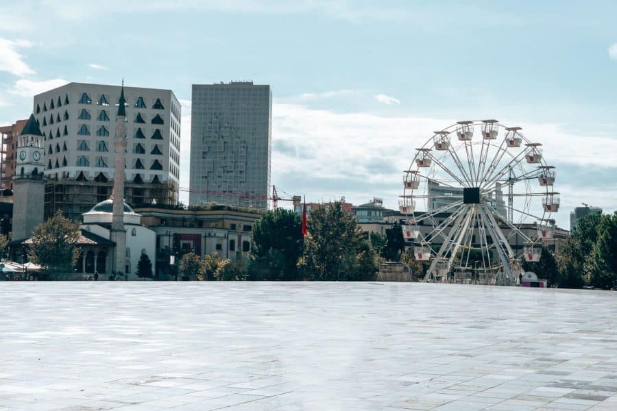 A ferris wheel and a large open space at Skanderbeg Square, best things to do in Tirana, Albania