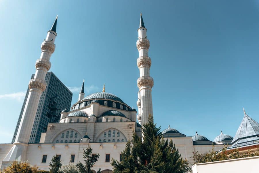 The beautiful blue and white Namazgah Mosque under a blue sky, Best things to do in Tirana, Albania