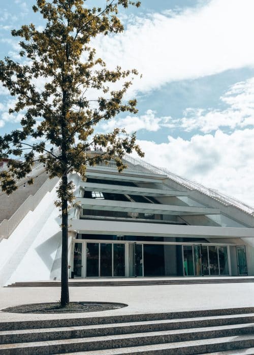 A large white pyramid with glass doors and windows, Pyramid of Tirana, Albania