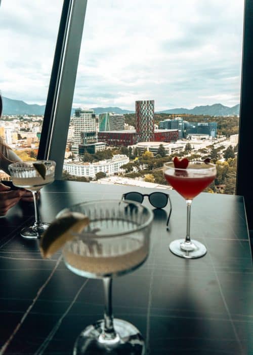 Two cocktails on a table while overlooking Tirana from above, Sky Club, Sky Tower Hotel, Best bars in Tirana