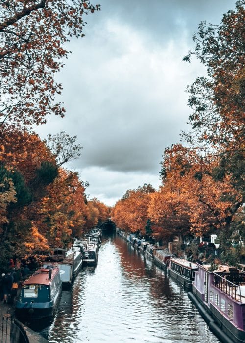 Regent's Canal lined with barges and framed with golden trees, Little Venice, 4 Day London Itinerary