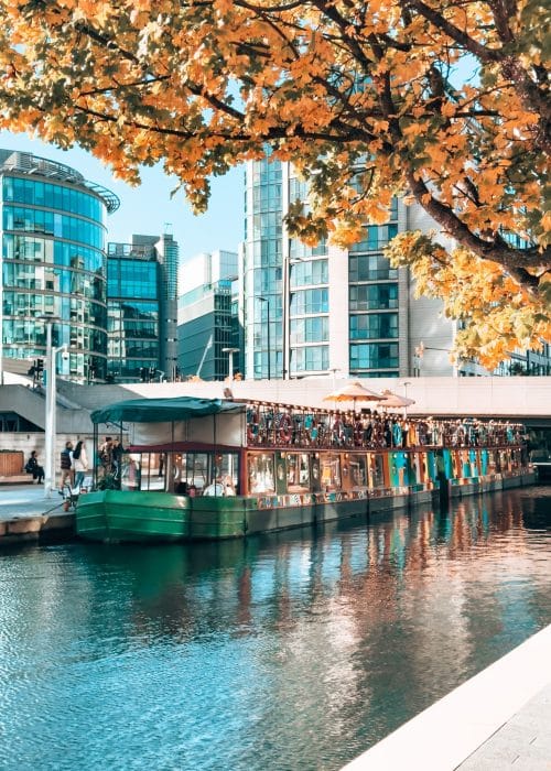 A multi-coloured barge on the water, Darcie & May Green, Paddington, London Itinerary