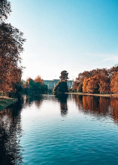 Buckingham Palace at the end of the pond in St James's Park, The Blue Bridge, London Itinerary