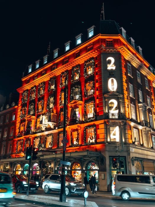 Exterior of Fortnum & Mason lit up like a 2024 advent calendar, best Christmas decorations in London 2025