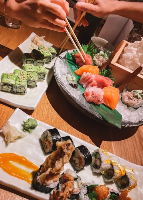 A table full of sushi and sashimi at Roka, Canary Wharf, London