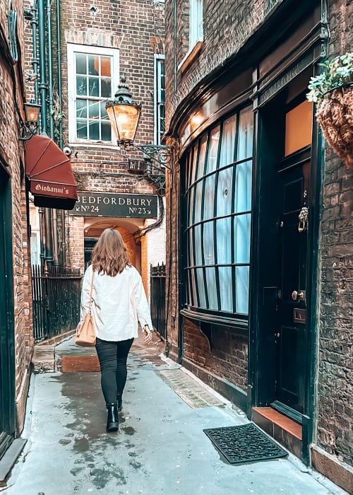 Helen walking down a beautiful narrow alley, Goodwin's Court, Covent Garden, London