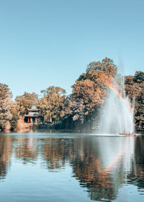 A peaceful lake with fountain in the middle and colourful Chinese pagoda on the other side, Victoria Park Lake, London Itinerary