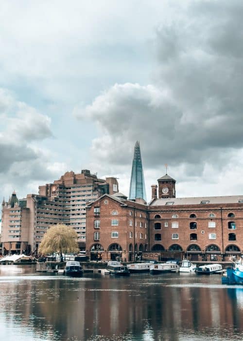 Boats on the water in front of historical buildings with The Shard behind, St Katharine Docks, 4 days in London