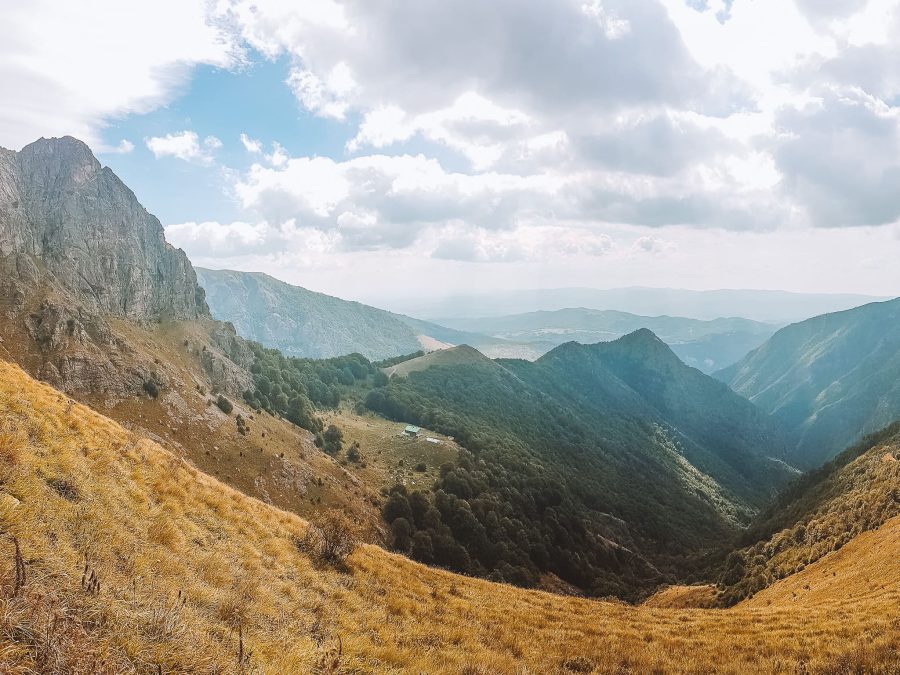 Rai Hut far below surrounded by mountains, Botev Peak, best things to do in Bulgaria