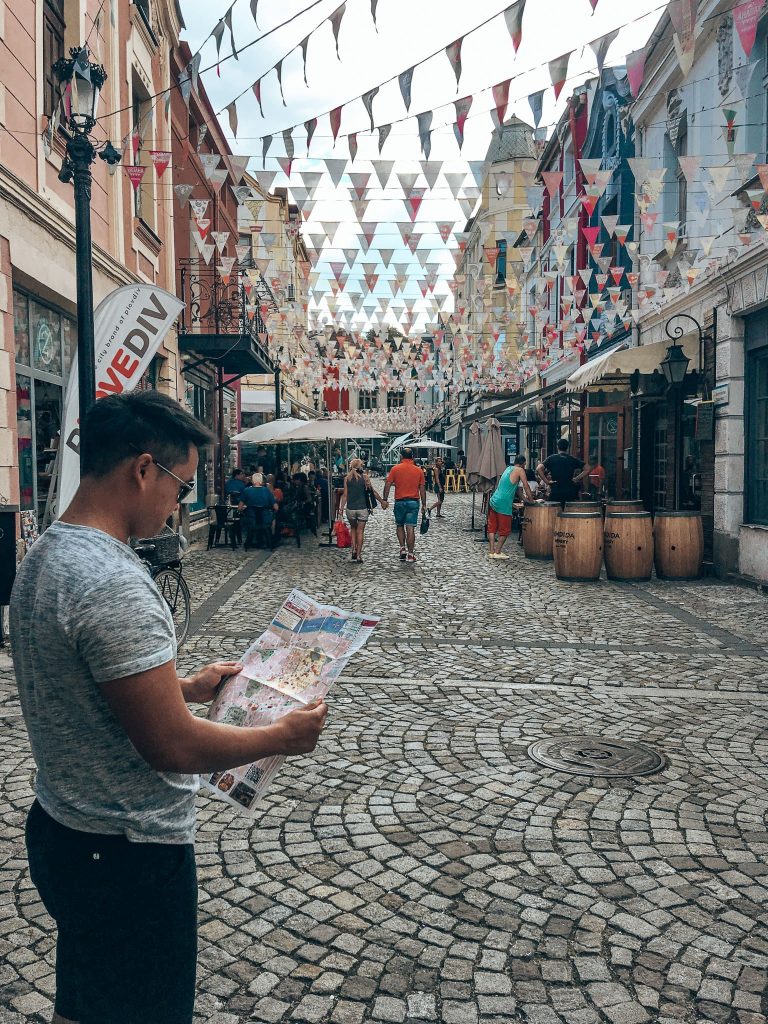 Andy looking at a map on the narrow cobbled streets in Kapana, Plovdiv, places to visit in Bulgaria