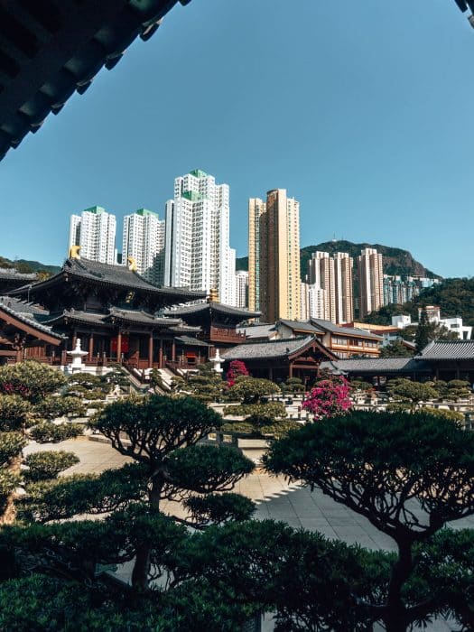 The spectacular temple complex with contrasting high rises towering above in the background, Chi Lin Nunnery and Nan Lian Garden, Hong Kong