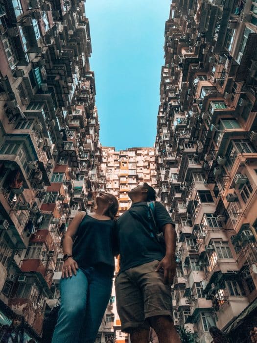 Both of us looking up at the compact apartment buildings, Montane Mansion, Monster Building, Hong Kong