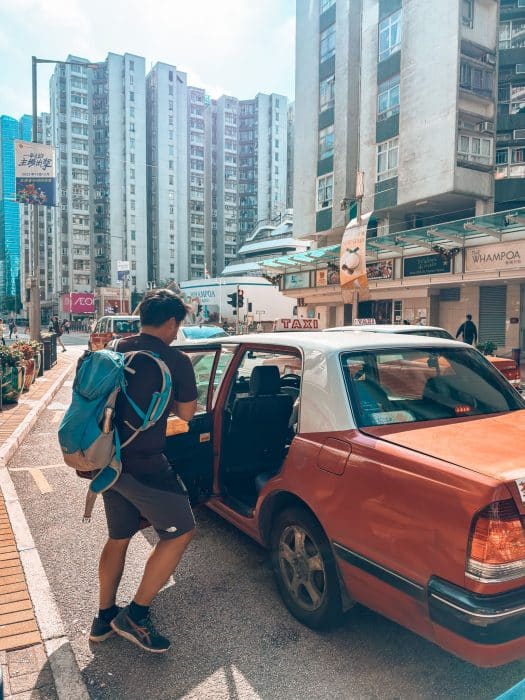 Andy getting into a taxi in Hong Kong