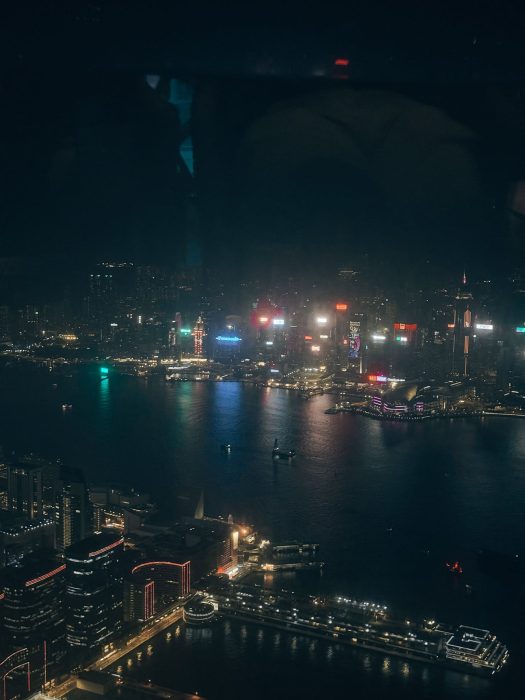 The view across Kowloon, Victoria Harbour and Hong Kong Island at night from Ozone, Ritz-Carlton Hong Kong